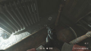 Лежащая около стола карточка звезды №15 «Мэнни Саксон», Wolfenstein II: The New Colossus